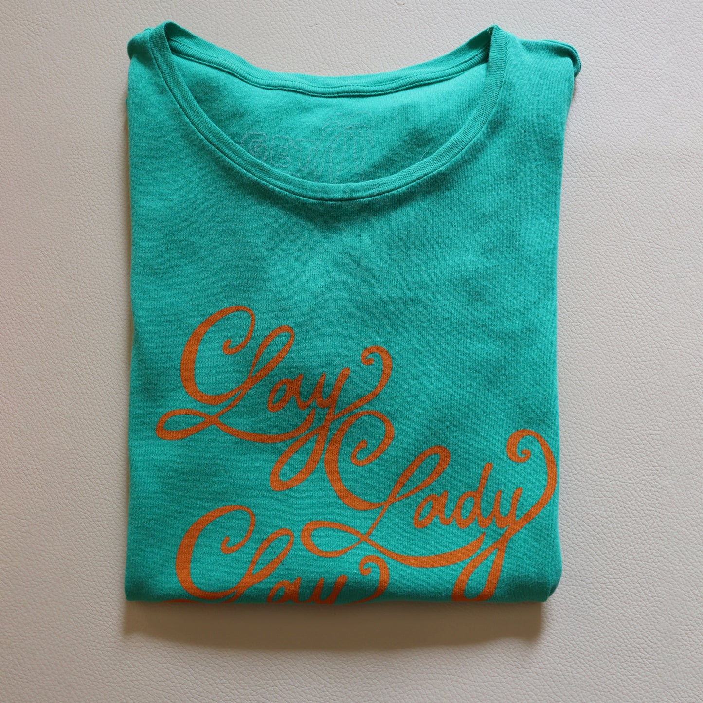 LAY LADY LAY ORANGE ON GREEN TEE SHIRT