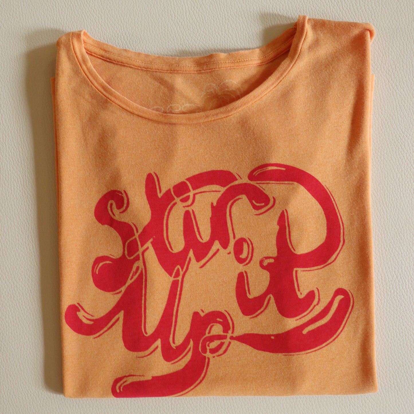 STIR IT UP ORANGE TEE